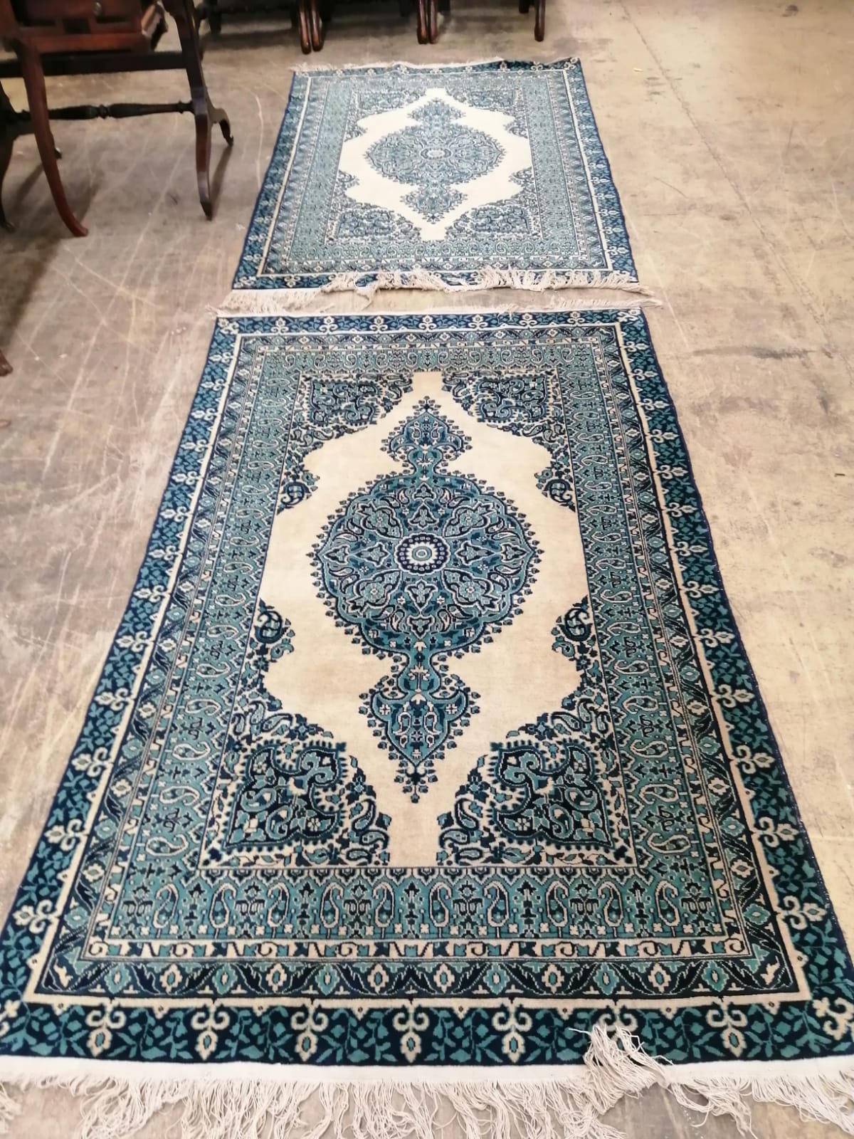 A pair of machined Persian style ivory ground rugs, 190 x 122cm